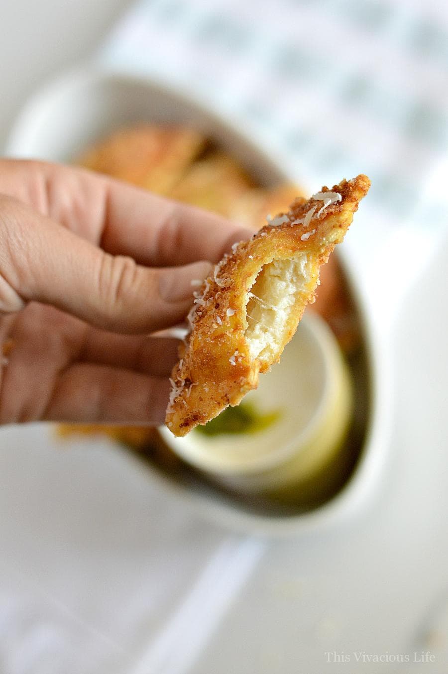 gluten-free fried ravioli with pesto Alfredo sauce