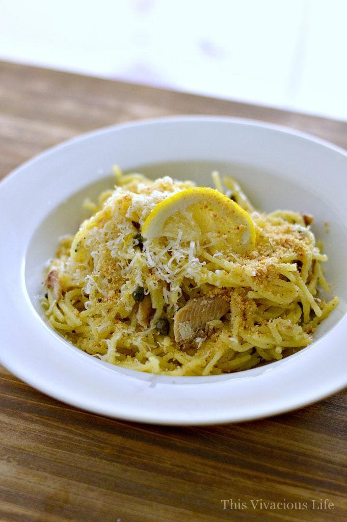 This gluten-free seafood pasta with lemon capers is absolutely delicious and straight out of Italy! The fresh parmigiano and gluten-free breadcrumbs are the the crowning jewel to this dinner.