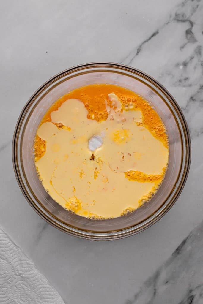 Pecan Pie Bread Pudding ingredients in a bowl