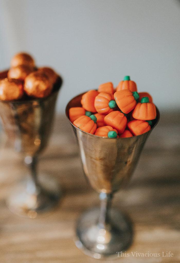 Candy pumpkins in silver goblets