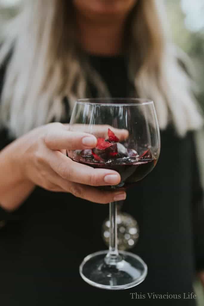 Black sangria non-alcoholic mocktail in a wine glass