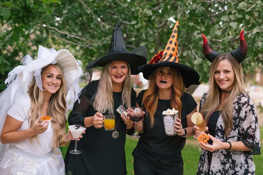 Four ladies dressed as witches for Halloween