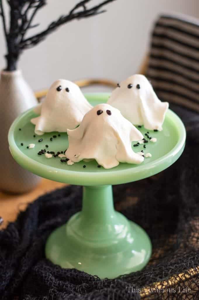 No-bake ghost cookies on a jadeite cake stand