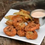 Gluten-free coconut popcorn shrimp, fried in coconut oil, never tasted so good! The best part? It's simple to make & even non-seafood fans will love them.