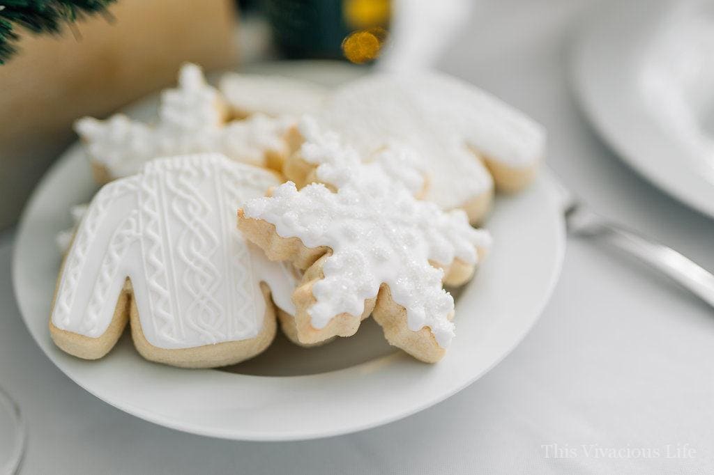 White sweater and snowflake sugar cookies