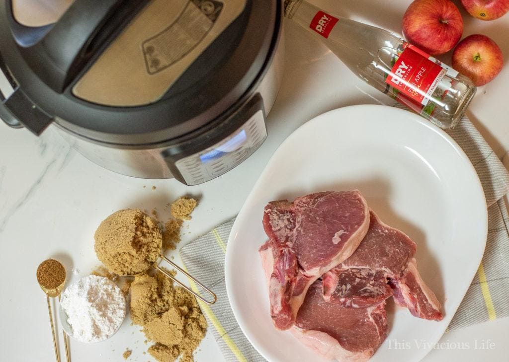 Instant Pot and ingredients for pork chops with cinnamon apples