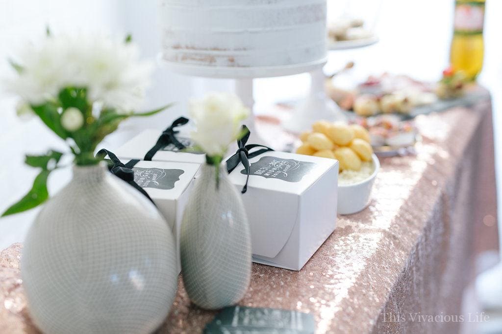 This clean slate New Years Eve party is bright and fun with a touch a slate black beauty. There are lots of delicious appetizers and goodies plus some beautiful clean slate resolutions cards for guests to write on. Everyone will go home with some midnight snack boxes as well. 