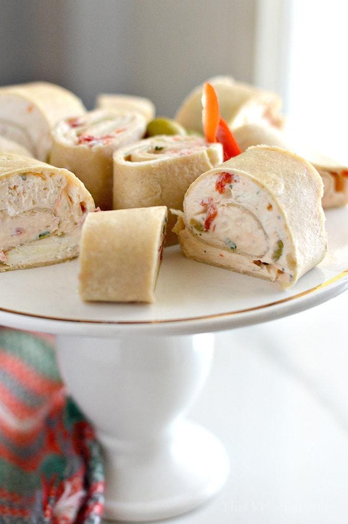 These Christmas party pinwheels tortilla rollups are so delicious and a great holiday appetizer. You are going to love these because they are so easy to make and serve up to a crowd. They are also a gluten-free appetizer.