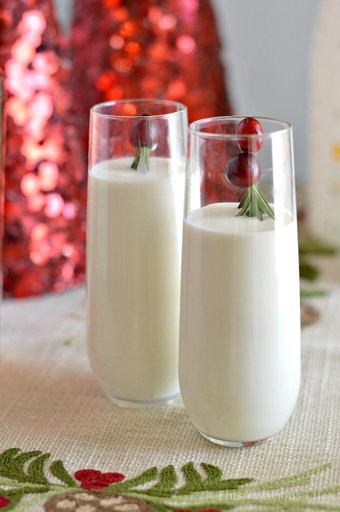 Non-alcoholic white Russian mocktail in two glasses with cranberries