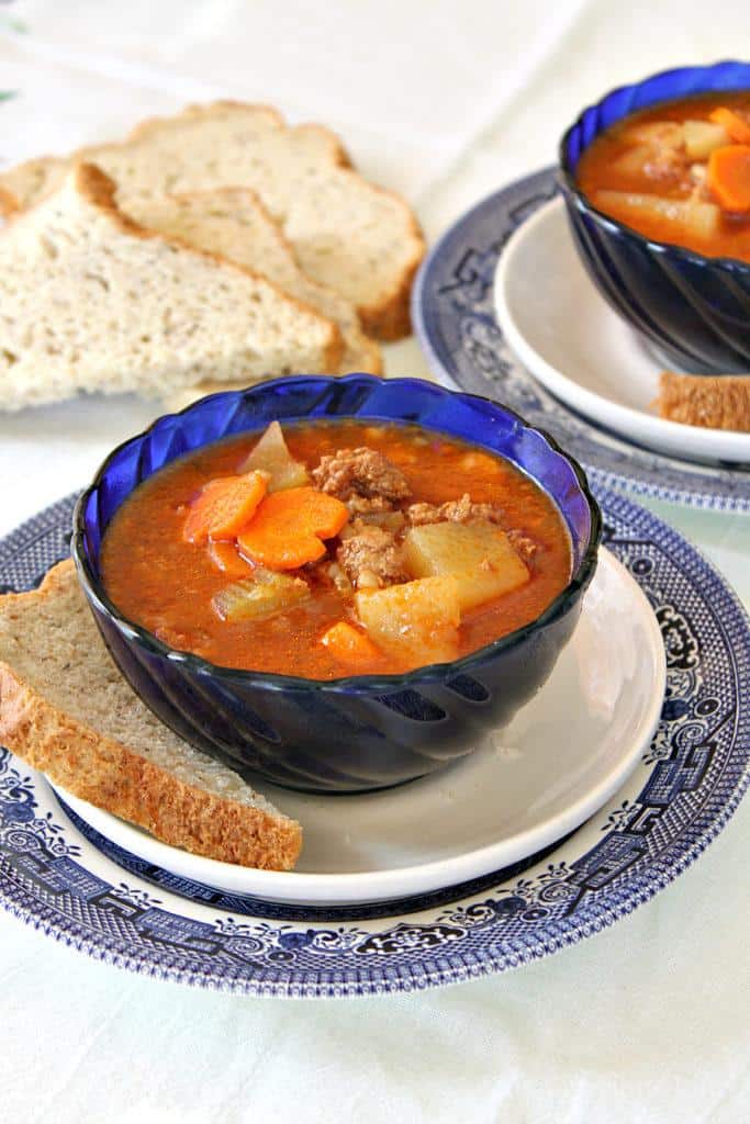 Instant pot hamburger soup in a blue bowl