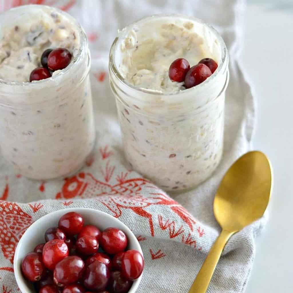 Easy Overnight Muesli in glass jars with cranberries
