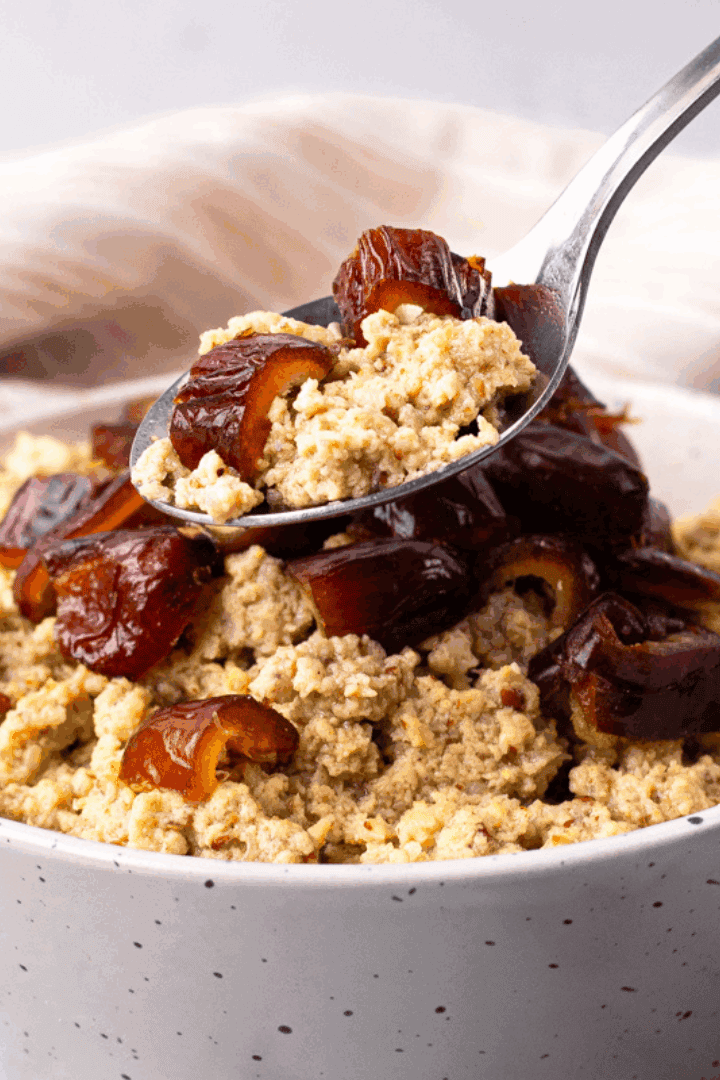 Side image of spoon scooping out a spoonful ofCreamy Paleo Oatmeal (with no oats)