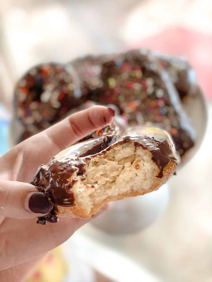 Gluten-free donut bitten out of with chocolate frosting