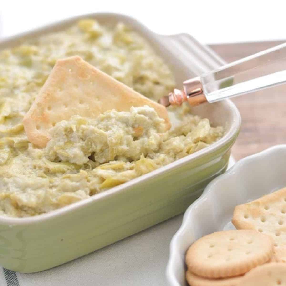 instant pot artichoke dip in a green pan