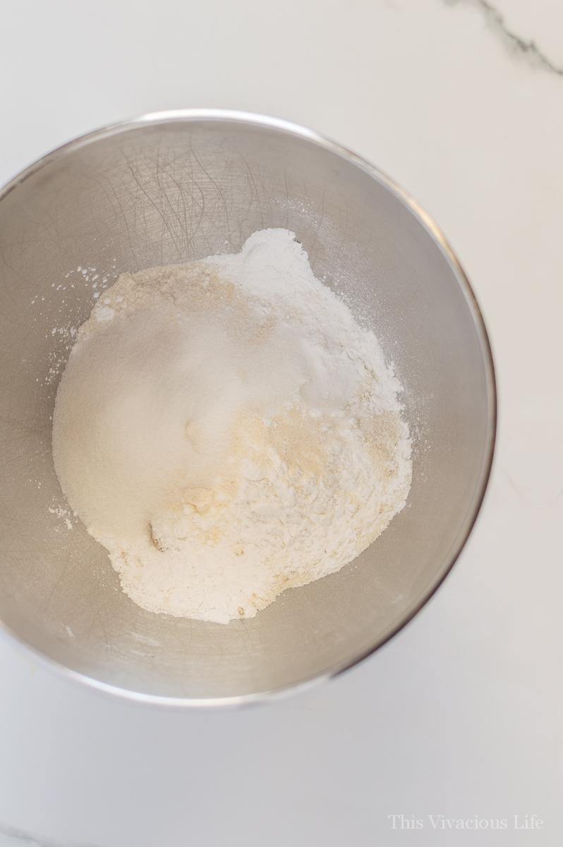 Dry pancake ingredients in a stainless steel bowl