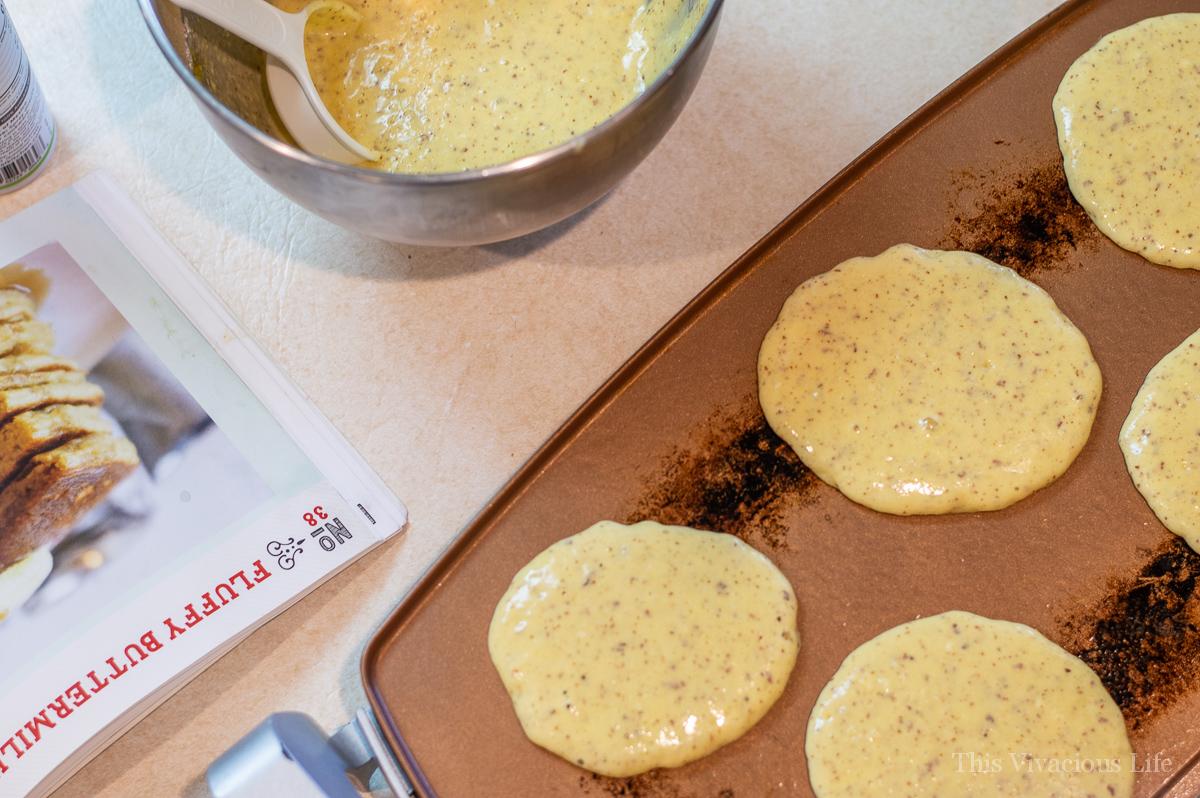 Pancake batter cooking on a griddle