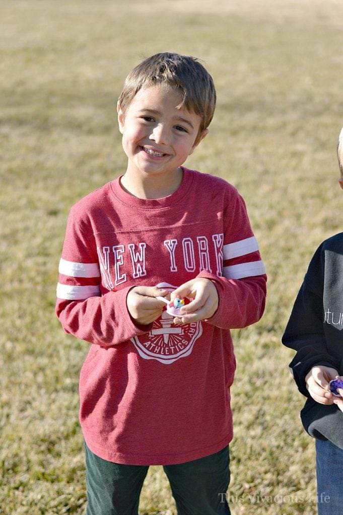 Little boy with Hatchimals toy