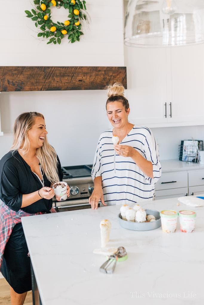 Sisters laughing while eating ice cream cake pops