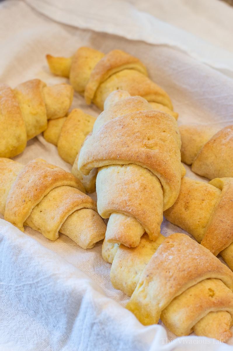 A batch of crescent rolls in a white towel