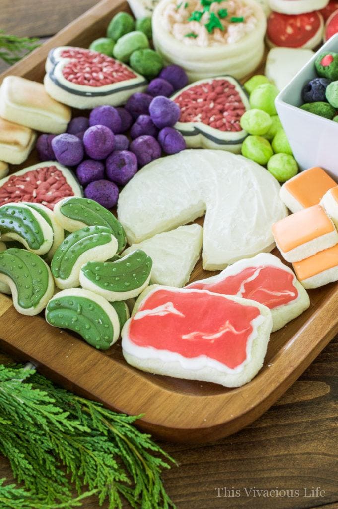 These charcuterie cheese board cookies are so realistic and fun! They make a wonderful dessert after a delicious cheese and charcuterie board spread. || This Vivacious Life #recipe #charcuterie #charcuterieboard #cookies #cookierecipe #funcookies #thisvivaciouslife