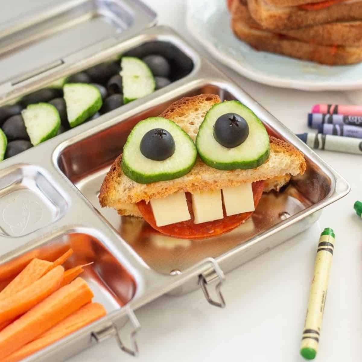 pizza grilled cheese monster sandwich in a tin lunchbox