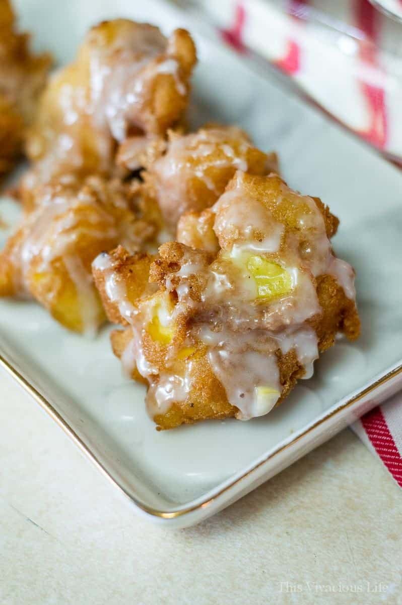 Gluten-free apple fritters with glaze on a plate