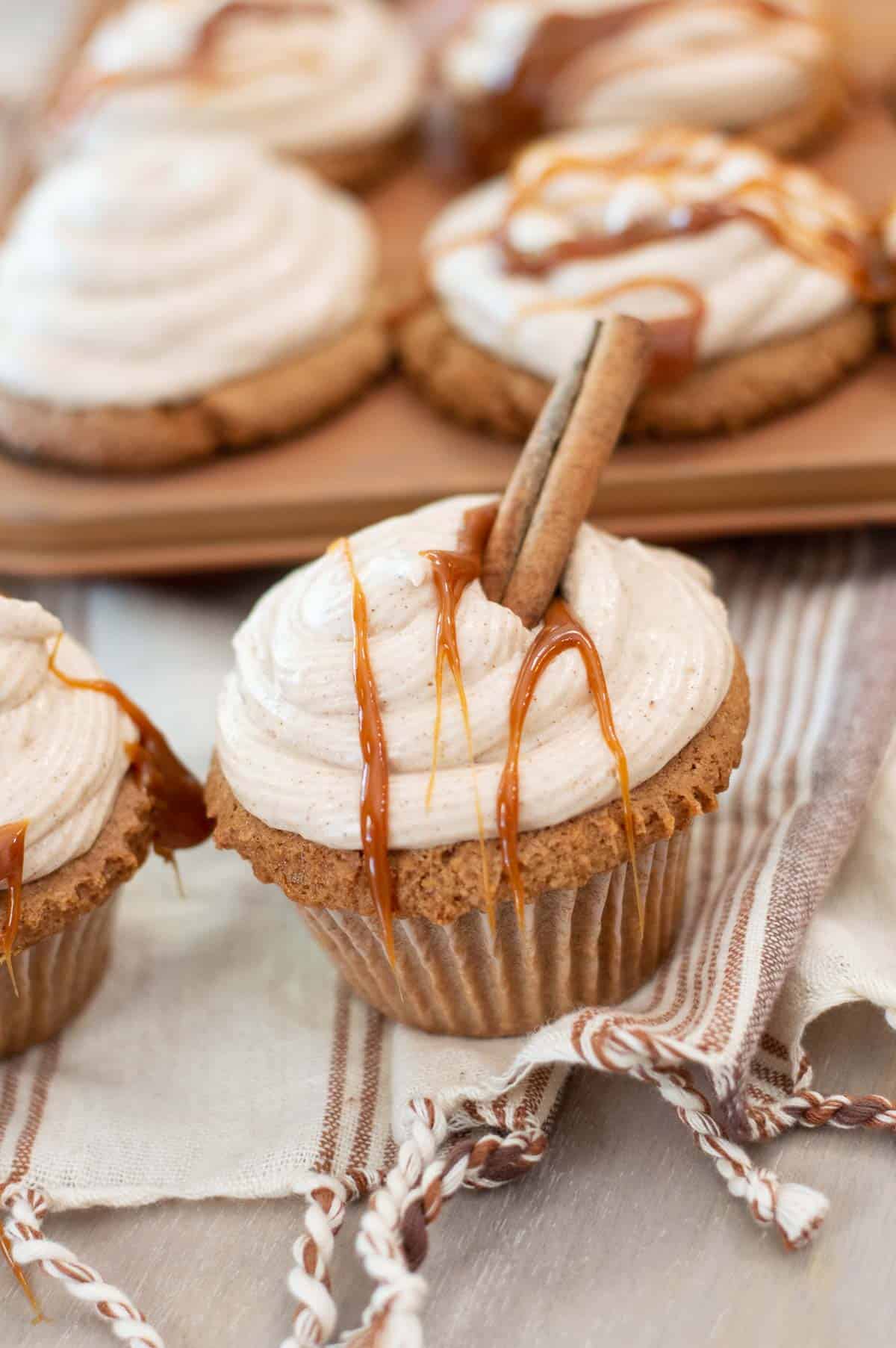 Easy Apple Cider Cupcakes with a cinnamon stick
