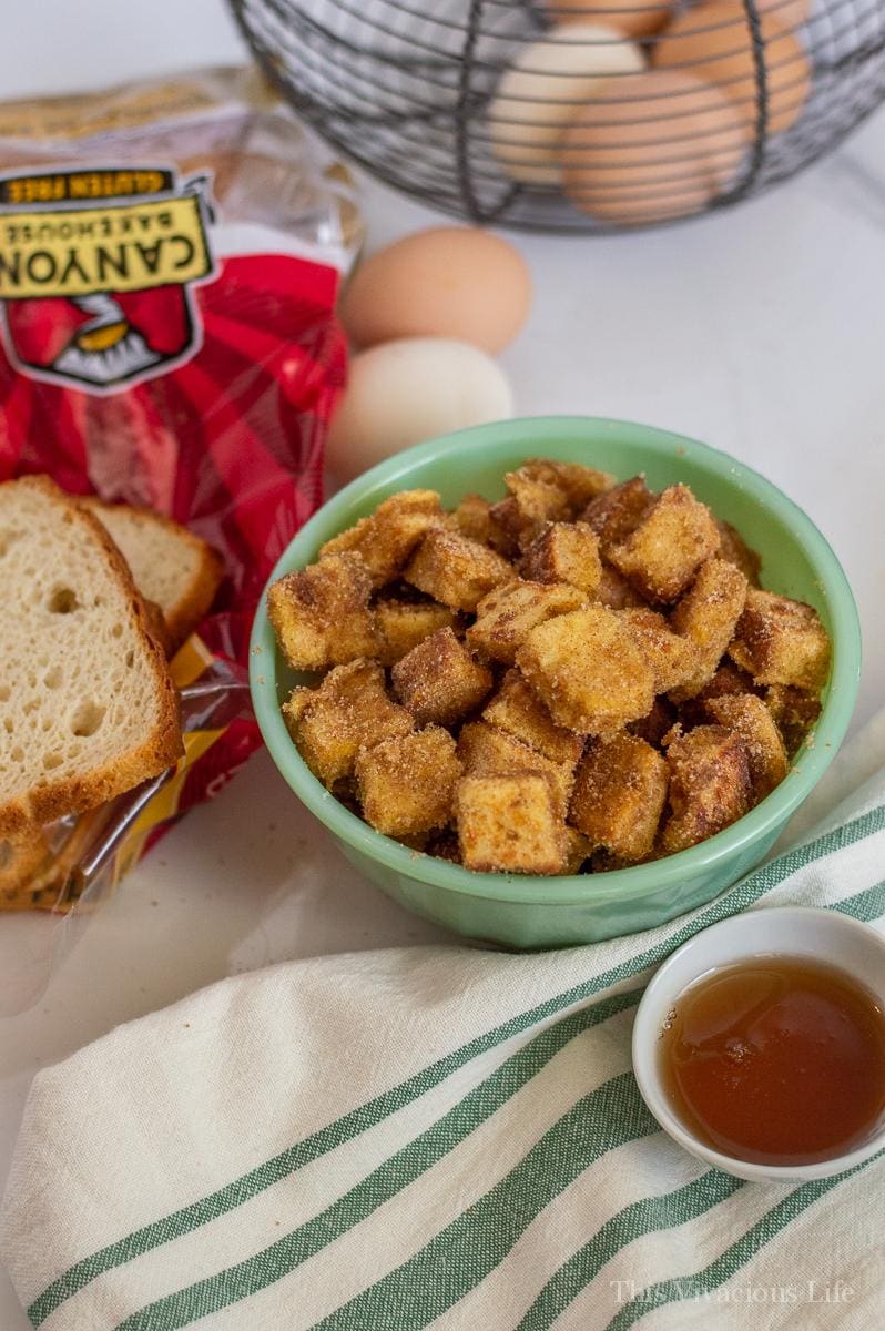 French toast bites in a green bowl