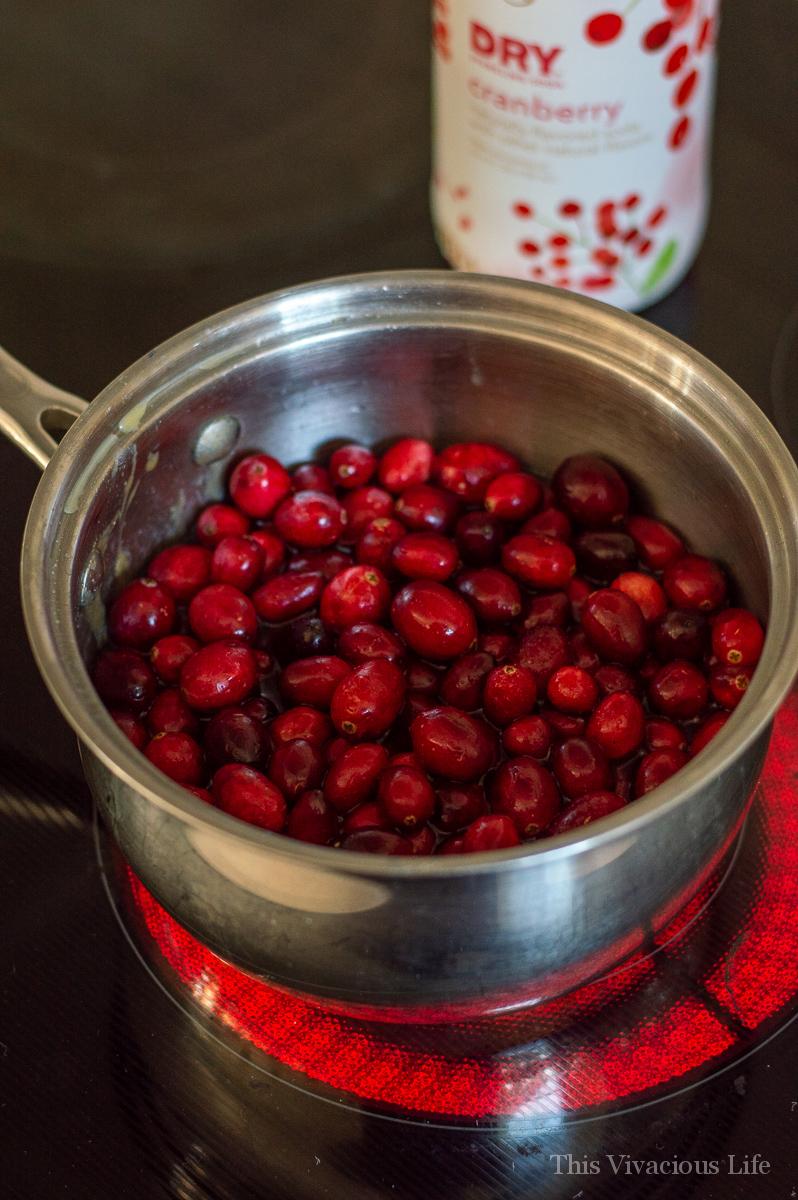 cranberries in a saucepan on the stove