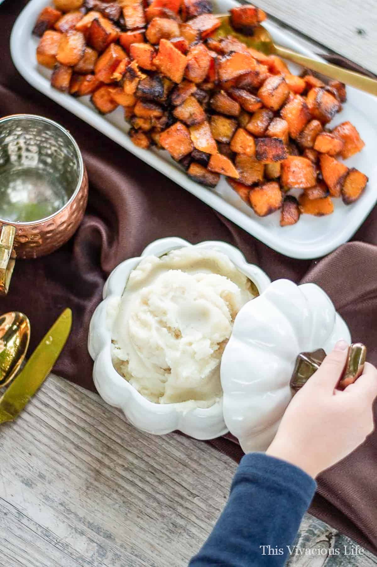 White pumpkin bowl with mashed potatoes inside