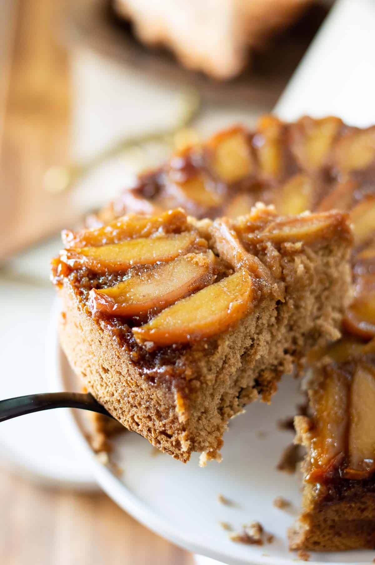 Gluten free apple cake on a white cake stand