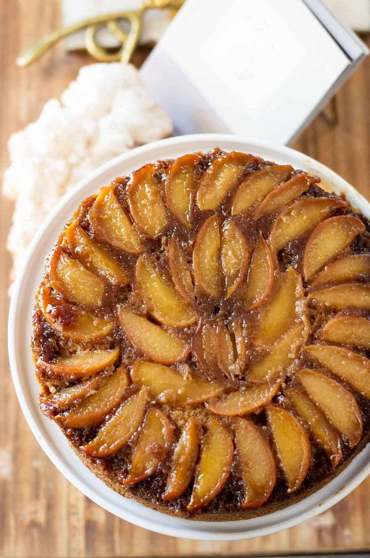 Gluten free apple cake on a white cake stand