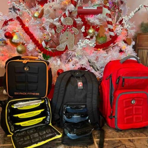 6 pack bags by Christmas tree