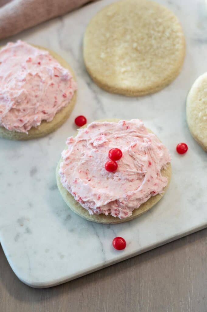 Cookies with red hot frosting on a white plate