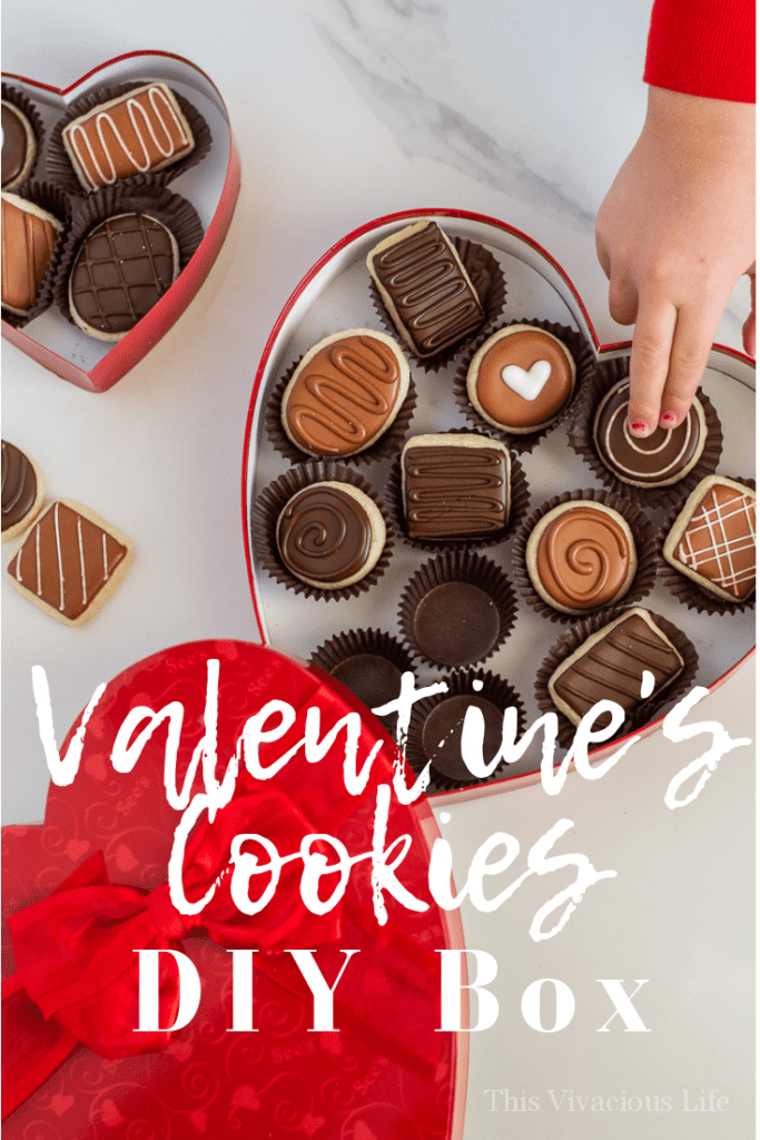 Valentine's Day sugar cookies in a DIY chocolate heart box are a fun gift to give a loved on. Can you only need THREE things to make this cute box?!