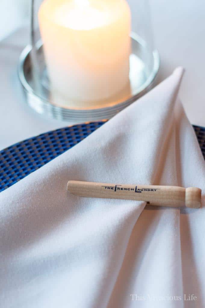White linen napkin with a wood pin at the French Laundry