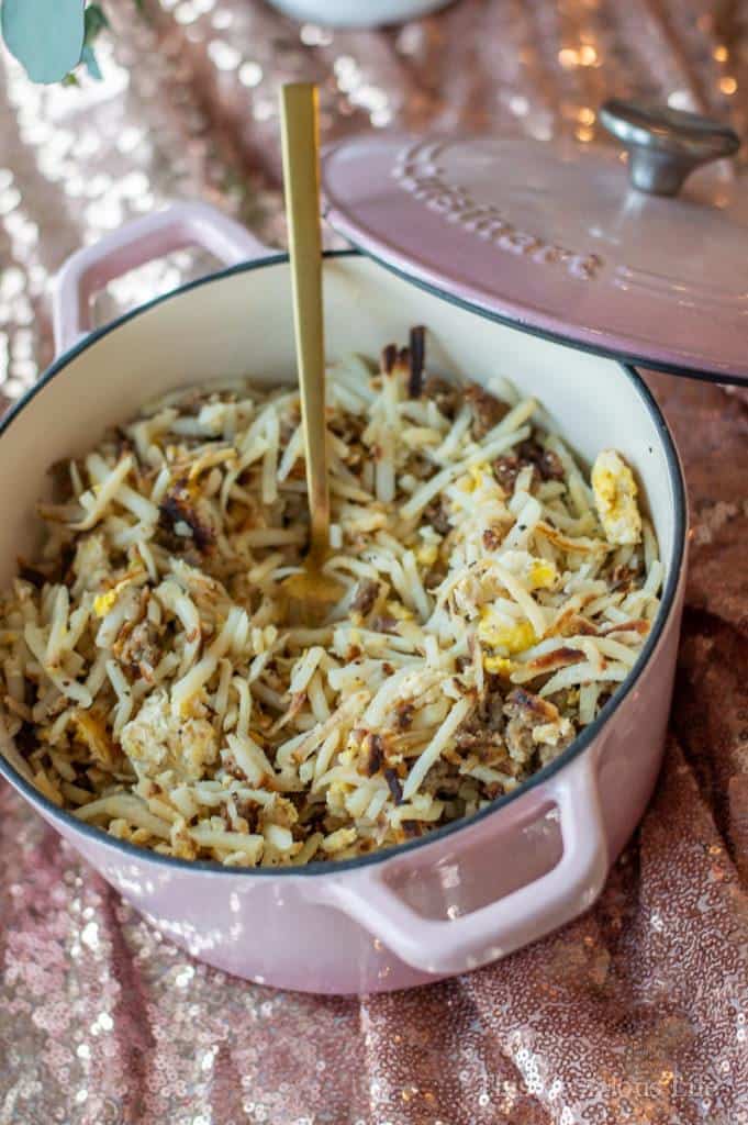 Hashbrowns in a pink cast iron pan