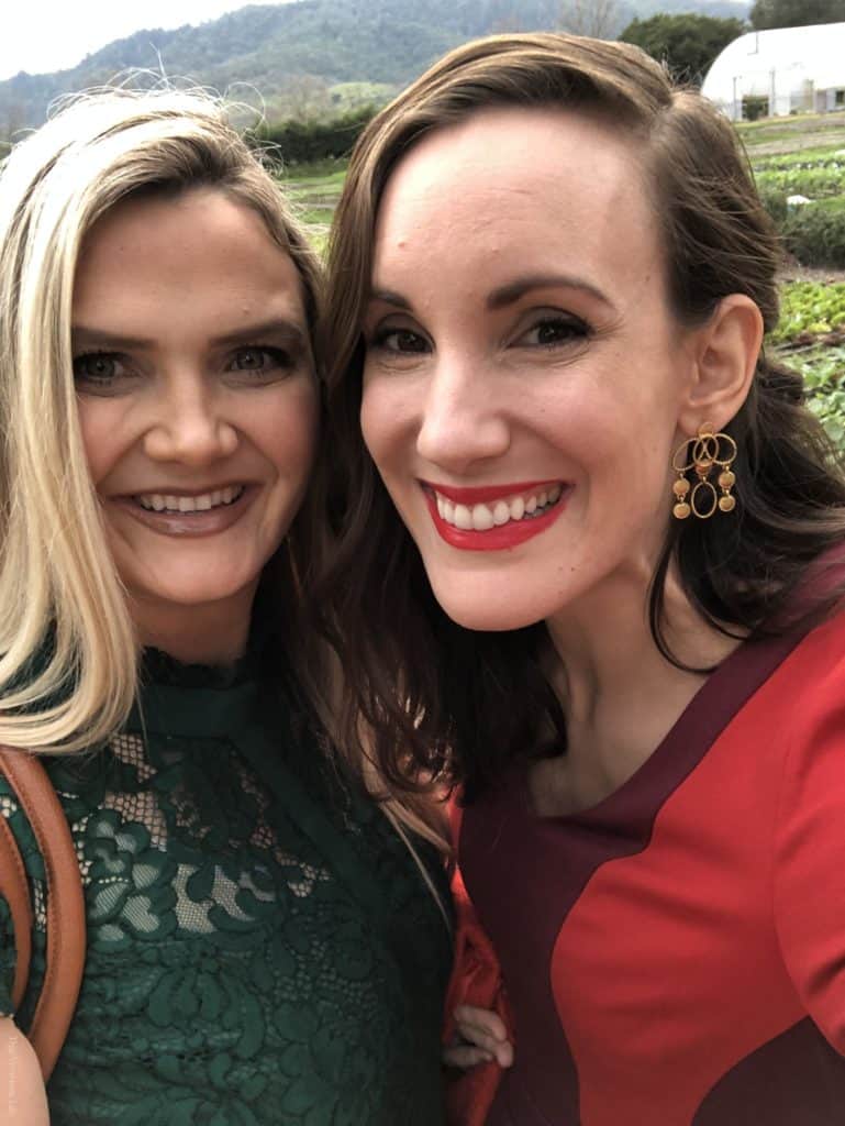 Two women smiling and taking a selfie