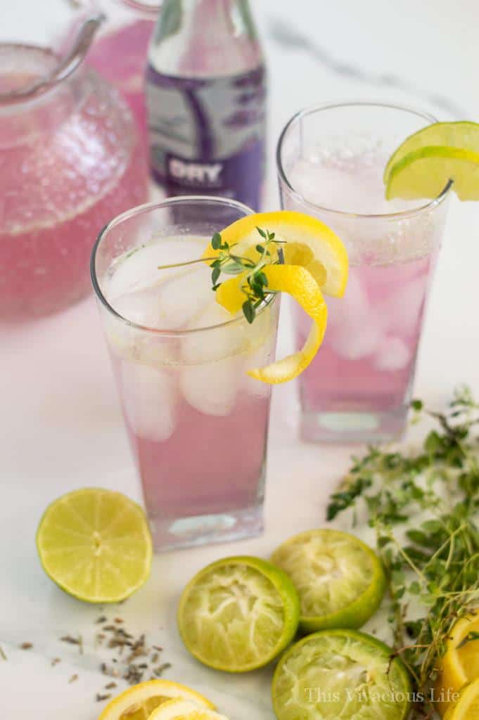 Glass filled with lavender lemonade and lemon zest 