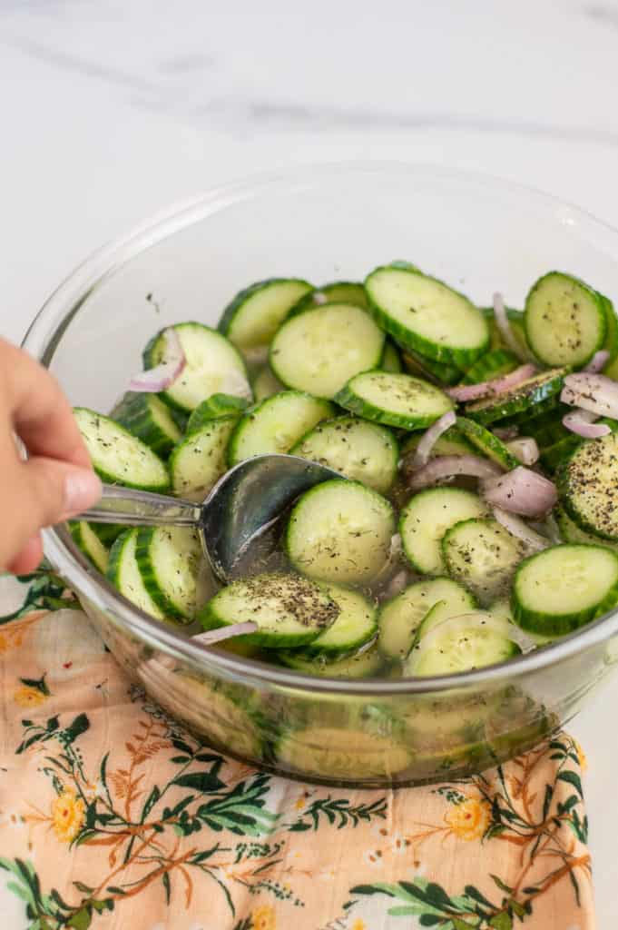 Best cucumber salad in a bowl with a spoon