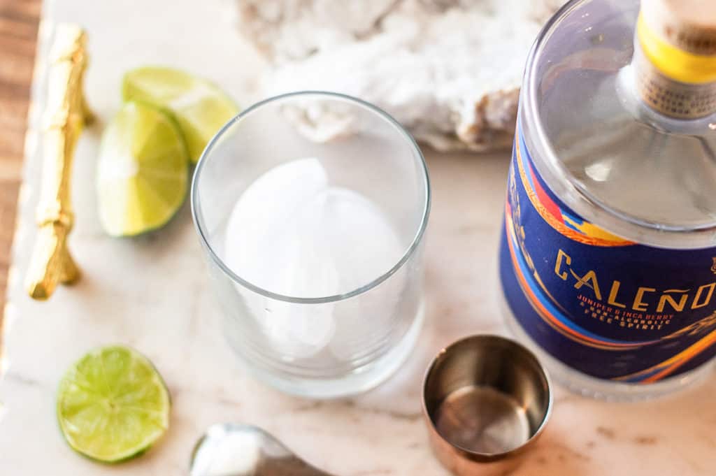Ice in a glass cup on a marble plate
