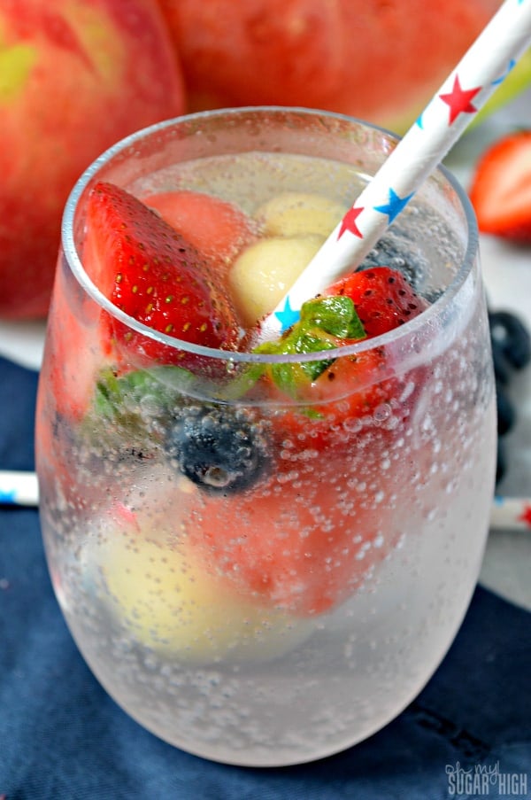 Patriotic water in a glass with a straw