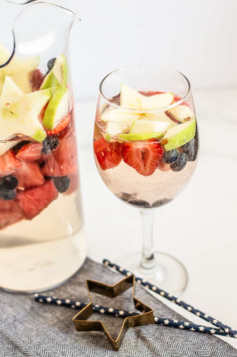Wine glass with red, white and blue fruit