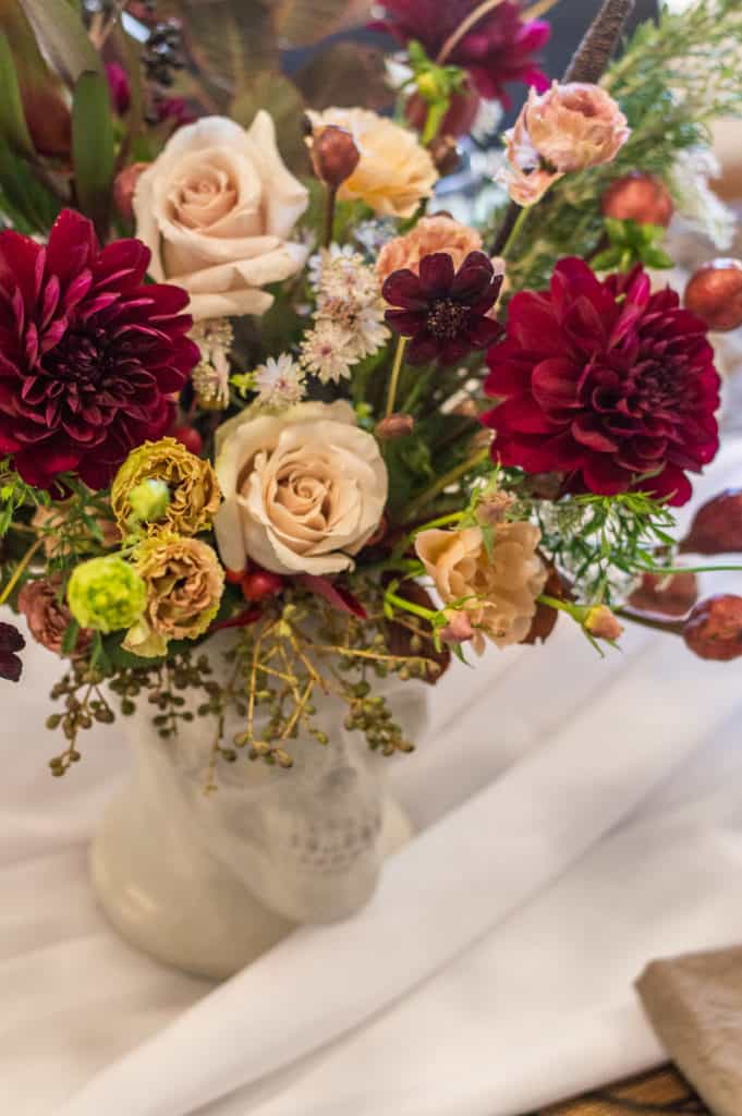 Halloween flowers in skull vase