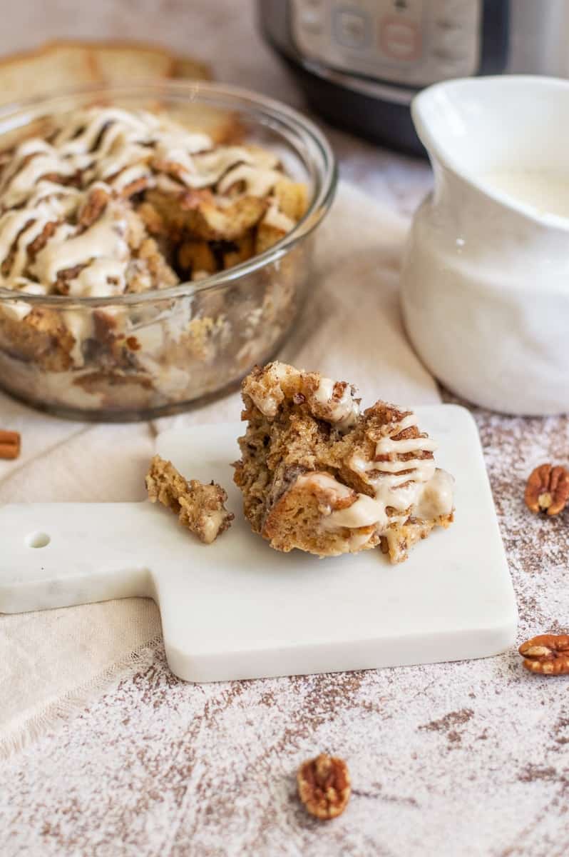 Cinnamon roll French toast casserole in a bowl and on a plate