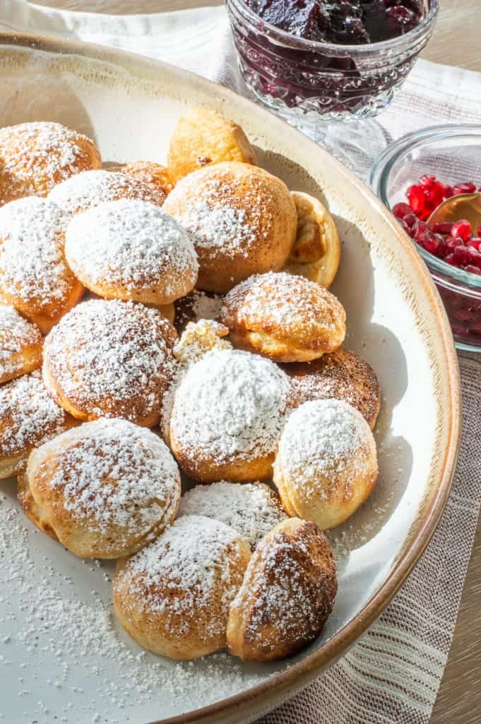 Ebelskiver recipe with powdered sugar on top in a bowl