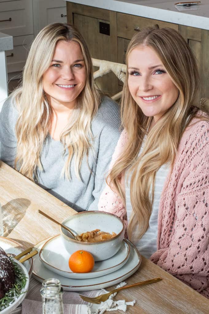 Two girls smiling at Hygge Christmas breakfast
