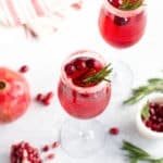 Prosecco drink with pomegranate and cranberries in a glass