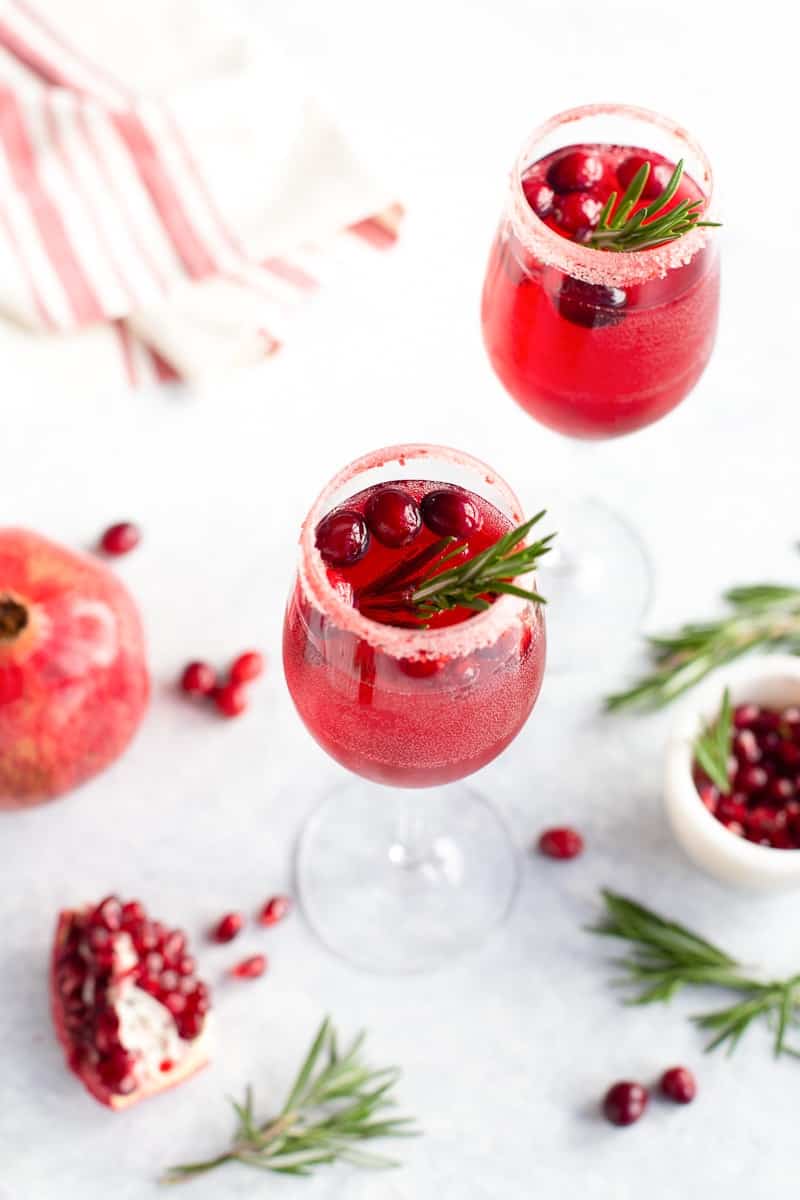 Non-alcoholic prosecco drink with pomegranate and cranberries in a glass