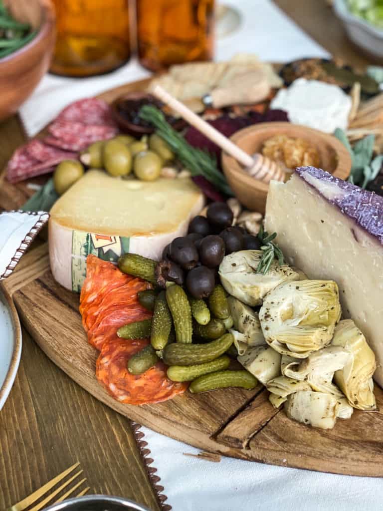 Charcuterie board with olives, cheese and meats